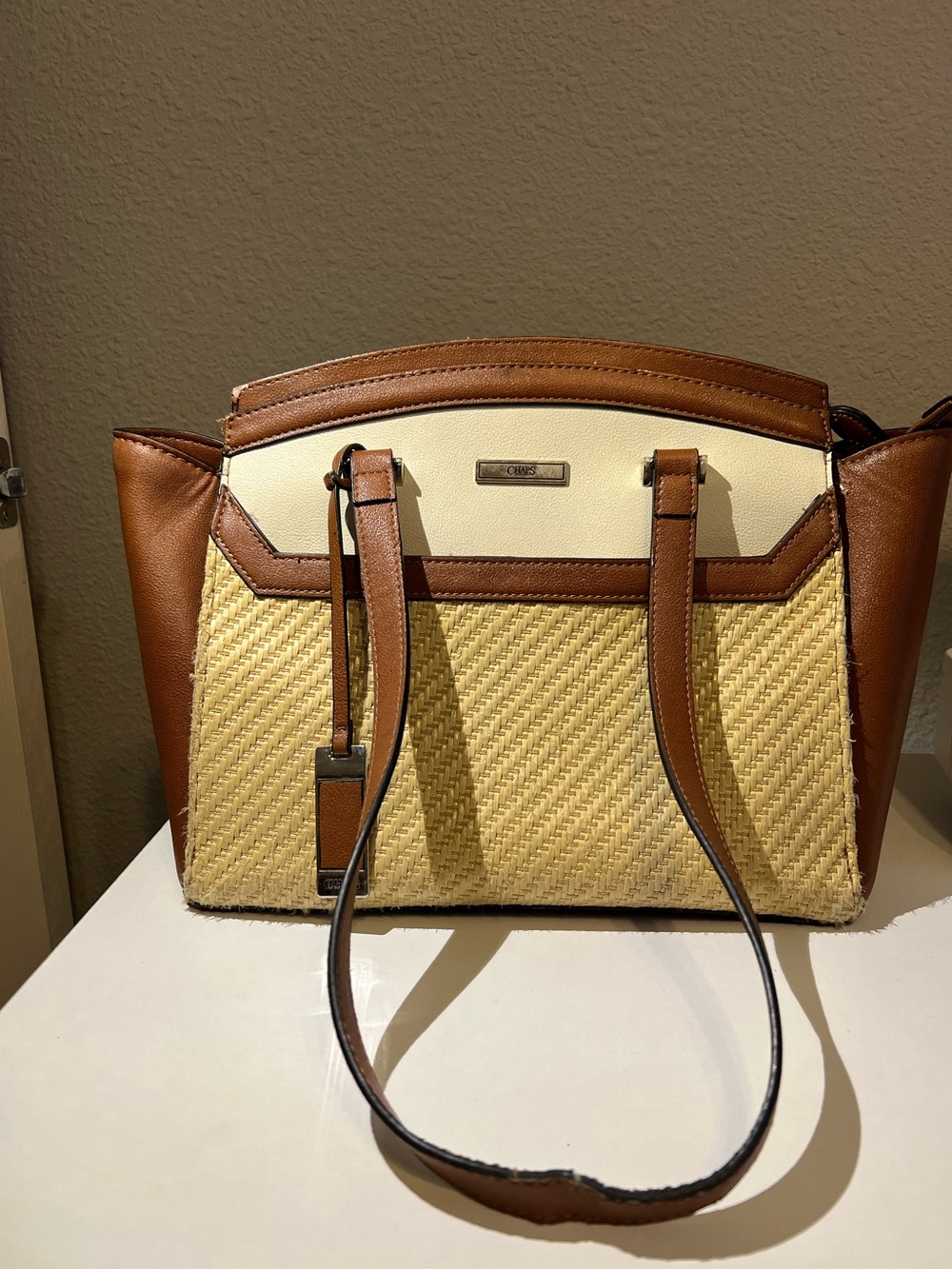 Chaps over the shoulder bag